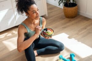 Athletic woman eating Protein at Breakfast